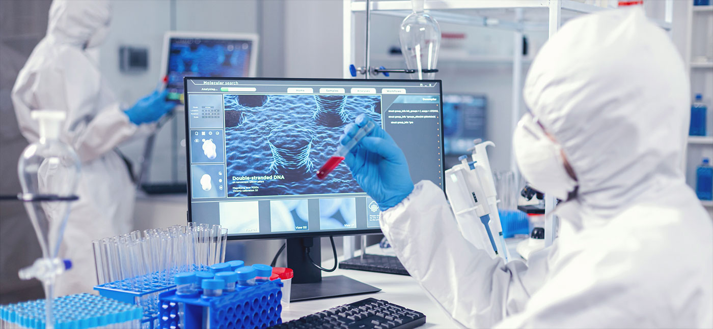 A scientist in a hazmat suit analyzing a blood sample in a high-tech laboratory.